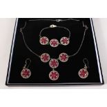 A THREE PIECE SILVER GILT AND RUBY SET BRACELET, NECKLACE AND EARRINGS.