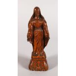 A CARVED BOXWOOD FIGURE OF THE VIRGIN MARY. 8ins high.