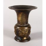 AN ARCHAIC BRONZE VASE. 6ins high.