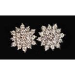 A PAIR OF 9CT GOLD DIAMOND CLUSTER EARRINGS.