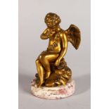 A GOOD QUALITY GILT BRONZE CUPID on a circular marble base. 5ins high.