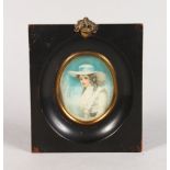 A FRAMED OVAL PORTRAIT OF A YOUNG LADY. 3ins x 2.25ins.