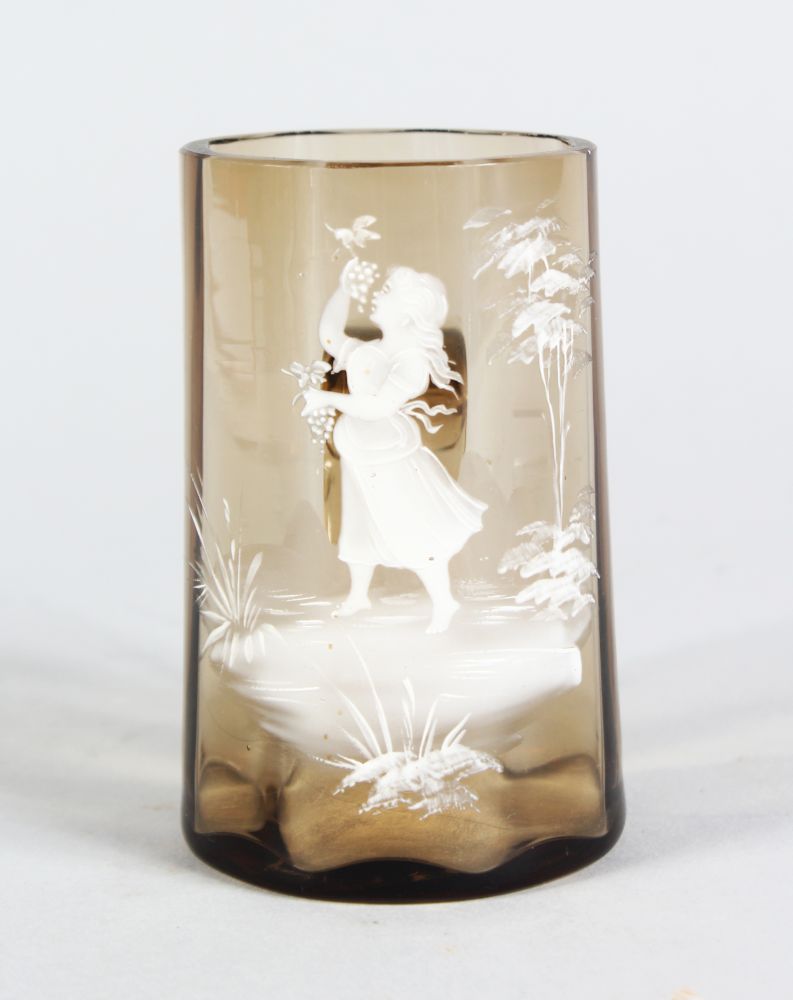 A VICTORIAN MARY GREGORY AMBER TANKARD, CIRCA. 1880, painted with a girl. 3.5ins high.