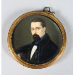 A CIRCULAR PORTRAIT OF A MAN, HEAD AND SHOULDERS. 2.5ins diameter, in a gilt frame.