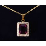 A 9CT GOLD, AMETHYST AND DIAMOND PENDANT AND CHAIN.