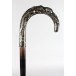 A WALKING STICK WITH CHINESE SILVER HANDLE.