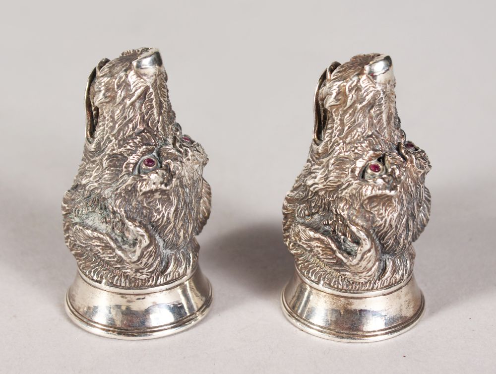 A GOOD HEAVY PAIR OF SILVER SEATED HUNTING DOG SALT AND PEPPER.