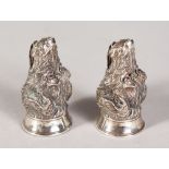 A GOOD HEAVY PAIR OF SILVER SEATED HUNTING DOG SALT AND PEPPER.