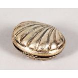 AN ENGRAVED SILVER SHELL SHAPED SNUFF BOX.