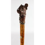 A WALKING STICK with carved wooden "DOG" handle by BRISAC, LONDON.