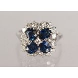 A GOOD 18CT WHITE GOLD, SAPPHIRE AND DIAMOND CLUSTER RING, 2.5CTS.