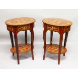 A PAIR OF FRENCH STYLE OVAL SIDE TABLES, with inlaid decoration, a single drawer on shaped legs