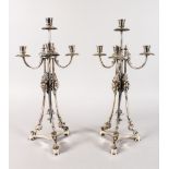 A GOOD PAIR OF CONTINENTAL SILVER FOUR LIGHT CANDELABRA with centre candle holder and three