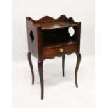 A 19TH CENTURY FRENCH MAHOGANY BEDSIDE TABLE with side drawer, on curving legs. 1ft 6ins wide x