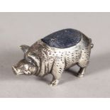 A SILVER HOG PIN CUSHION.