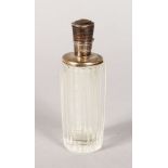 A CUT GLASS SCENT BOTTLE with silver top with key pattern engraving. 3.75ins.