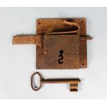 A LARGE, EARLY WROUGHT IRON LOCK AND KEY, POSSIBLY 16TH CENTURY. Lock Plate: 9.5ins x 9.5ins.