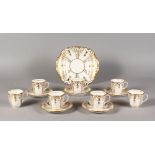 SEVEN DAVENPORT COFFEE CUPS, each with stylised gilded decoration; together with five matching