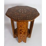 AN OTTOMAN INLAID OCTAGONAL TABLE with under-tier. 20ins high, 15ins long.