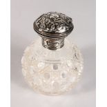 A CUT GLASS SCENT BOTTLE with silver top.