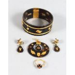 A TORTOISESHELL GOLD MOUNTED SUITE OF JEWELLERY, BRACELET, PENDANT, RING AND EARRINGS.