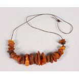 A STRING OF ANTIQUE AMBER BEADS, Possibly ROMAN.