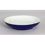 A CHINESE PORCELAIN SHALLOW BOWL OR BRUSH WASHER. with blue glazed sides. 6ins diameter.
