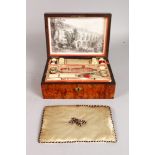 A GOOD 19TH CENTURY WALNUT SEWING BOX, figured case with mother-of-pearl shield, a print in the