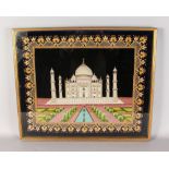 A FRAMED SILKWORK PICTURE OF THE TAJ MAHAL. 21ins x 25ins.