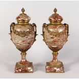 A VERY GOOD PAIR OF FRENCH MARBLE CASSOLETTES AND COVERS with ornate handles and garlands. 1ft