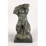 AN UNUSUAL ABSTRACT BRONZE FIGURE OF A MAN, on a rectangular marble base. 1ft 8ins high.
