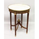 A FRENCH STYLE MAHOGANY, ORMOLU AND MARBLE CIRCULAR TABLE, the turned and fluted legs united by a