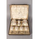 A ROYAL WORCESTER FINE CASED COFFEE SET OF CUPS AND SAUCERS and six silver spoons date code for