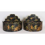 A PAIR OF TOLEWARE WALL POCKETS, black ground with Chinoiserie decoration. 11.5ins wide x 9ins