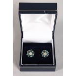 A PAIR OF WHITE GOLD AND PLATINUM SET BLUE DIAMOND EAR STUDS.