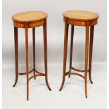 A PAIR OF SHERATON STYLE SATINWOOD OCCASIONAL TABLES, with oval tops on slender square legs united