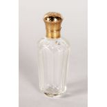 A CUT GLASS SCENT BOTTLE with 9ct gold top. 3.5ins.