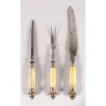 A BONE HANDLED THREE PIECE CARVING SET.