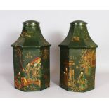 A PAIR OF TOLEWARE TEA CANISTERS, green ground with Chinoiserie decoration. 1ft 3ins high.