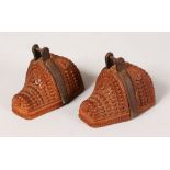 AN UNUSUAL PAIR OF CARVED WOOD MINIATURE SHOES with metal band. 4ins long.