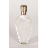 A CUT GLASS SCENT BOTTLE with silver top with key pattern engraving. 3.5ins.