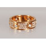 A SUPERB CARTIER STYLE 18CT ROSE GOLD AND DIAMOND SET RING.