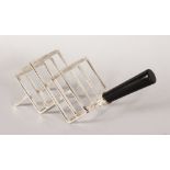 A CHRISTOPHER DRESSER DESIGN FOUR DIVISION TOAST RACK with turned ebony handle.