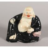 A PORCELAIN FIGURE OF HOTEI. 4.5ins high.