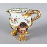 A VERY GOOD CAPO-DI-MONTE JUG, the body painted with flowers, with three bold mask feet, gilt