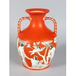 A LARGE ORANGE PORCELAIN PORTLAND VASE with printed design. 10ins high.