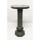 A GREY MARBLE PEDESTAL on an octagonal base. 3ft 6ins high.