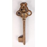 A HEAVY CAST IRON KEY, possibly 16TH-17TH CENTURY. 12ins long.