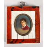 AN OVAL MINIATURE, HEAD OF A BOY. 2ins x 1.5ins.