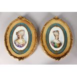 A VERY GOOD PAIR OF PORCELAIN PORTRAIT PANELS OF LADIES, with blue and gilt surround. 12ins x